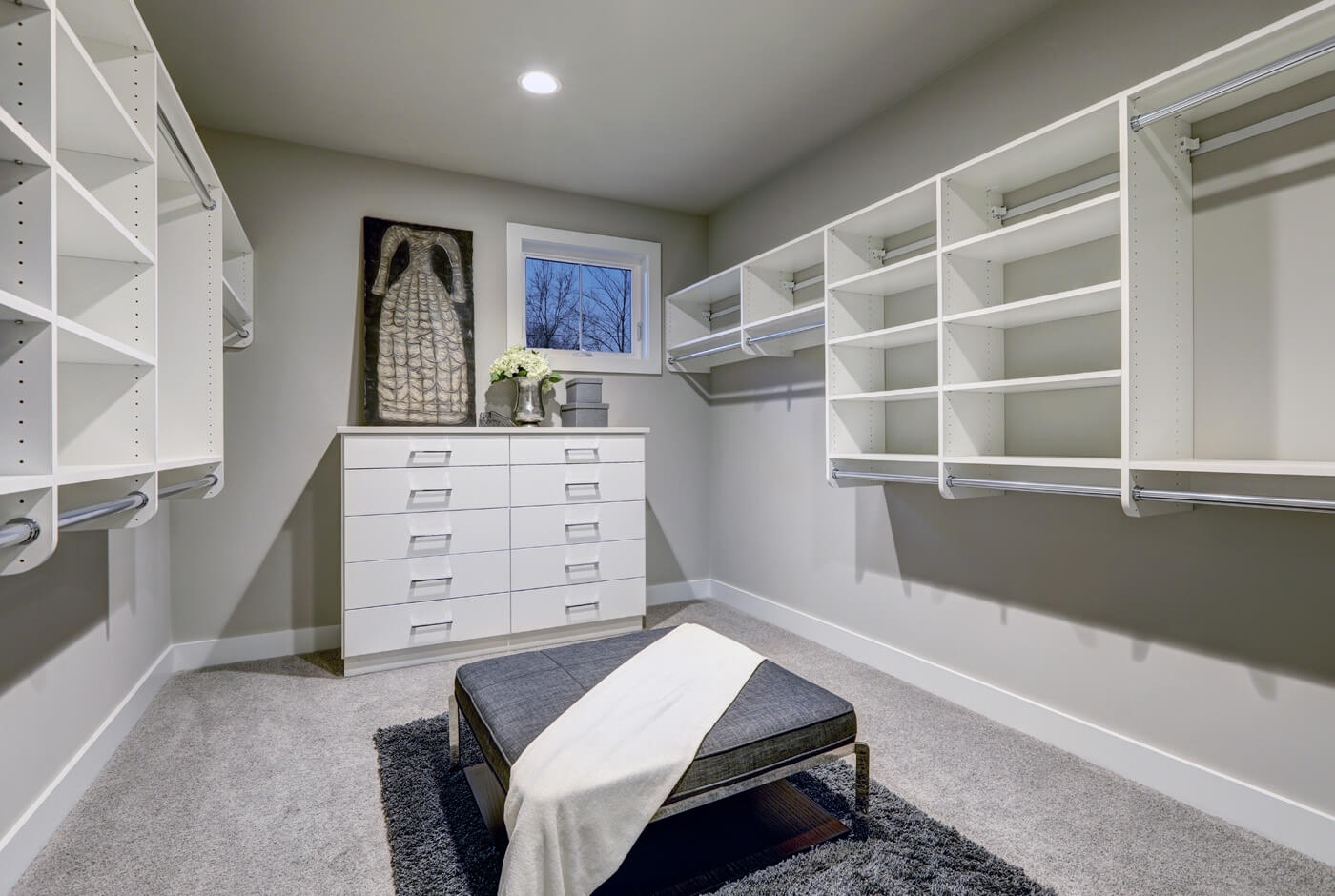 a room with a bench and shelves