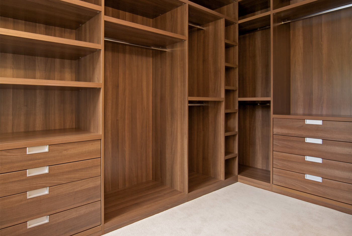 a large wooden closet with shelves