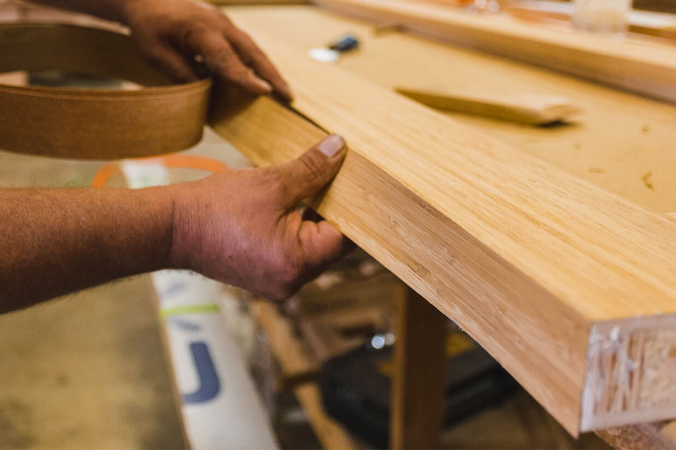 Lamination being applied to a panel product